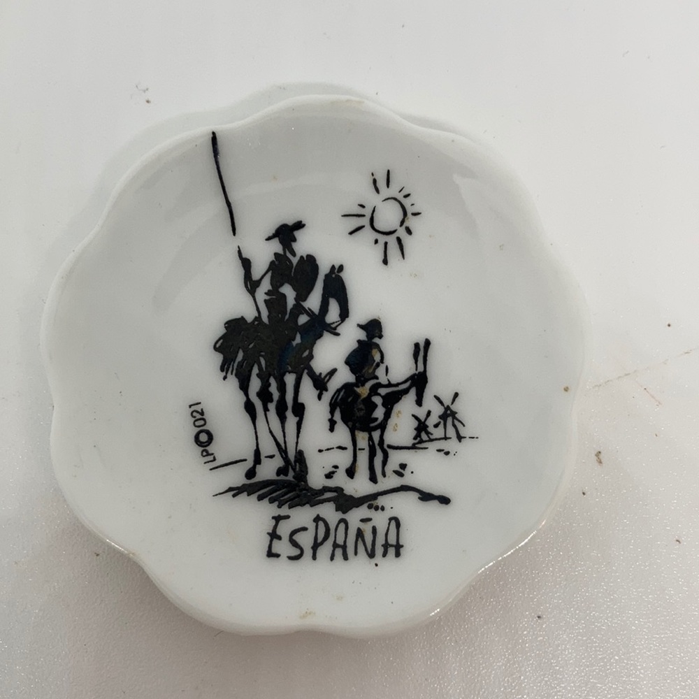 Don Quixote?  Pancho?  I don’t know but I see some windmills on this tiny plate